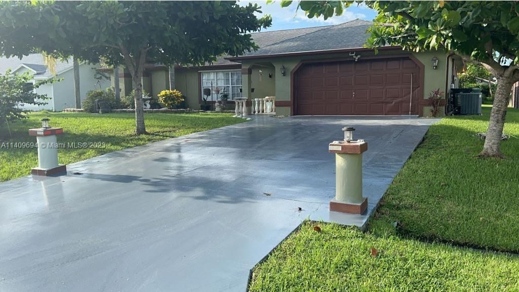 Photo of 665 SW College Park Rd, Port Saint Lucie, FL 34953 (MLS # A11409694)