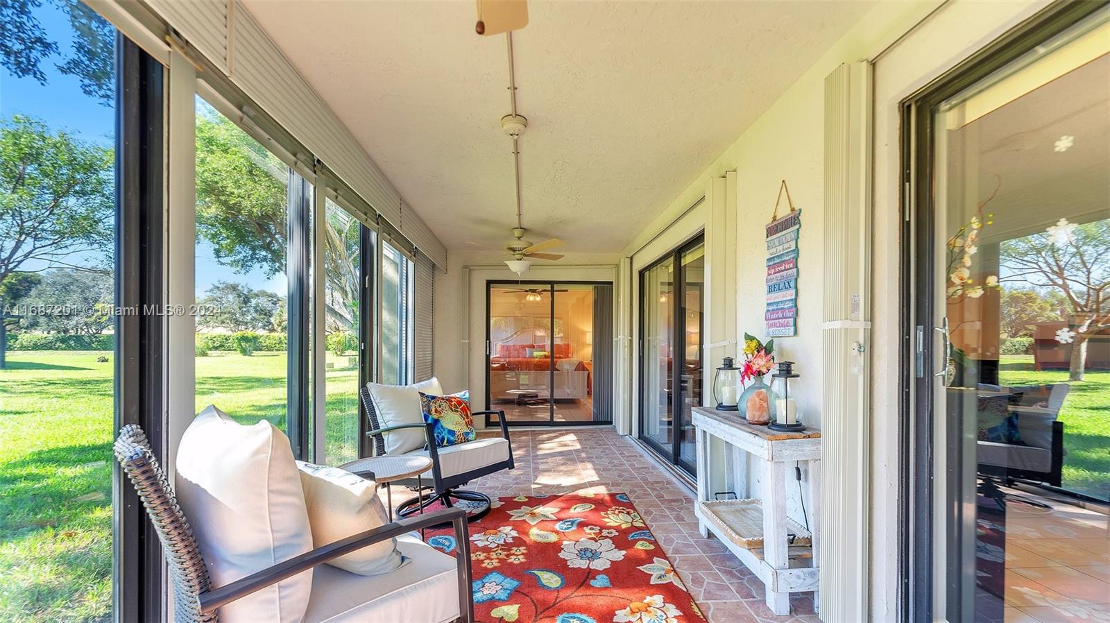 PRICE REDUCED BY $50K – SELLER MOTIVATED FOR IMMEDIATE SALE! Discover endless possibilities in this charming corner unit, featuring a very spacious & open floor plan enhanced by a glass-enclosed Florida room adding extra square footage for relaxation. Well-appointed kitchen & living area ready for your personal touches to reflect your style. The expansive primary bedroom suite offers a peaceful retreat, while the third bedroom is set up as an open den, easily convertible back to a private bedroom. Upgrades include new water heater, washer/dryer, impact windows & doors, & hurricane shutters for added peace of mind. Two assigned parking spaces in front of unit, this condo combines convenience and potential.