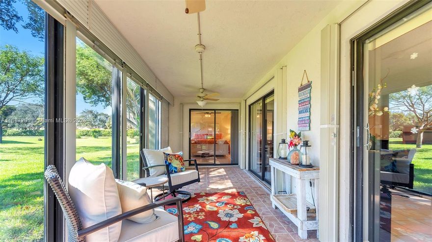 PRICE REDUCED BY $50K – SELLER MOTIVATED FOR IMMEDIATE SALE! Discover endless possibilities in this charming corner unit, featuring a very spacious & open floor plan enhanced by a glass-enclosed Florida room adding extra square footage for relaxation. Well-appointed kitchen & living area ready for your personal touches to reflect your style. The expansive primary bedroom suite offers a peaceful retreat, while the third bedroom is set up as an open den, easily convertible back to a private bedroom. Upgrades include new water heater, washer/dryer, impact windows & doors, & hurricane shutters for added peace of mind. Two assigned parking spaces in front of unit, this condo combines convenience and potential.
