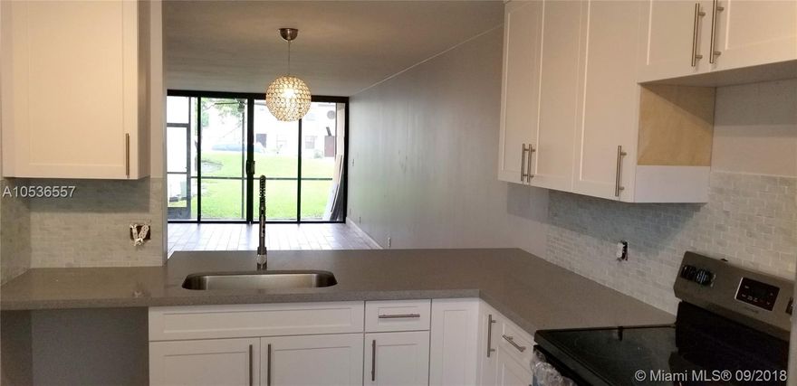 WHAT A PRIVILEGE!  TO MOVE INTO A TOTALLY RENOVATED CONDO! Quartz Counters in the Kitchen & Bathrooms, New "Wood Plank Style" Ceramic Floors Through out. New Stainless Steal Appliances, New Washer/Dryer, Freshly Painted, Large Baseboards, Screened Lanai. Storage Closet, & 1 Assigned Parking Space.  Plenty of Guest Parking Available. *******(Association Requires 650 Credit Score)********
Easy Access & A Short Walk From Your Backyard To The Community Pool.  Great Neighborhood, Fantastic Schools.
This Condo Is So Beautiful, It Won't Last!