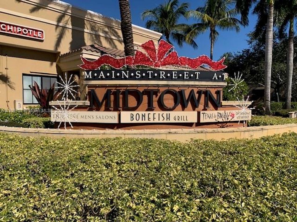 Photo of 4907 Midtown Ln #1113, Palm Beach Gardens, FL 33418 (MLS # A11803153)