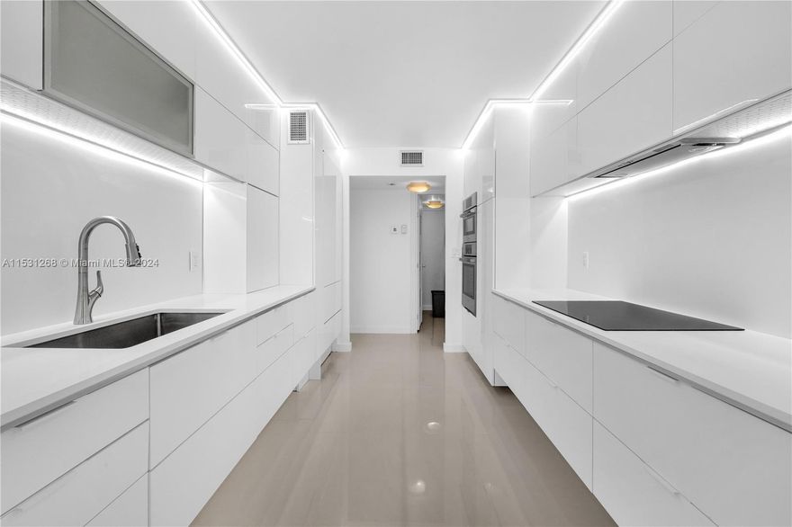 Stunning remodeled Penthouse 2/2 split floor plan Penthouse condo with alluring south-facing city, ocean, & bay views.This meticulously designed unit features a luxurious primary bathroom with a Roman tub, separate shower, his and hers vanity, & walk-in closets. Porcelain tiling and Spanish modern cabinetry adorn the space, while a Subzero fridge enhances the kitchen, offering seamless flow into the living area through sliding doors & balcony.High-impact windows ensure natural light floods the open space. Enjoy amenities like two pools, a well-equipped gym, card & game rooms,for epicurean delights, look no further than the fantastic Italian restaurant conveniently located within the building. Experience the epitome of urban luxury living in this move-in ready abode.