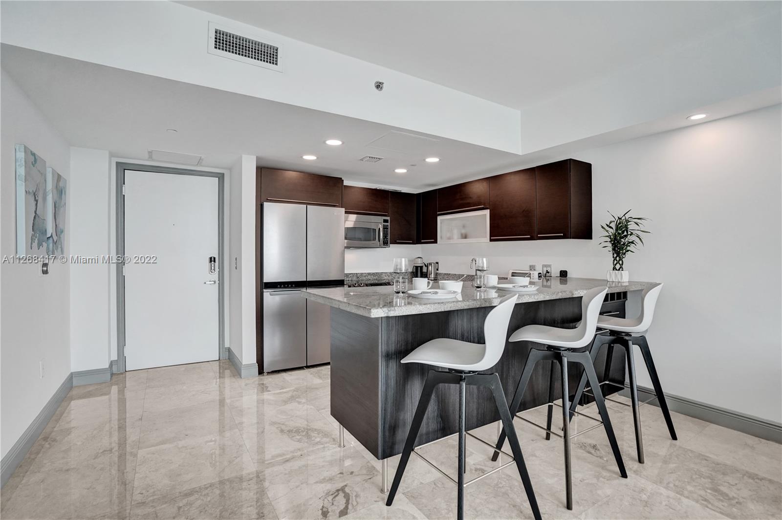 THE PLAZA 901 BRICKELL CO - Residential Lease