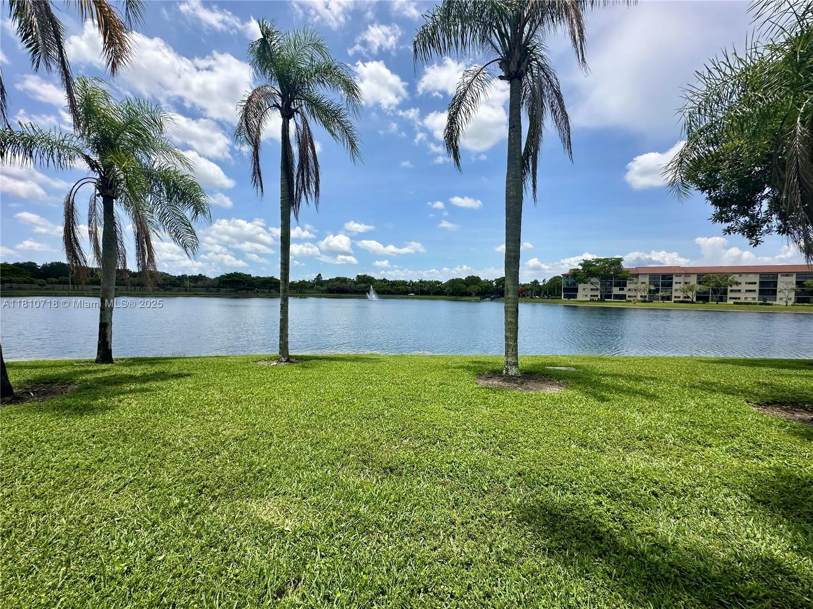 Completely remodeled 2/2 Open concept 1,533 square foot Corner condo boasts lake views from the back and side of the unit. Located in a guard-gated golf community. Upgrades include a Washer and Dryer in the unit, kitchen, both bathrooms, 32"x32" tile throughout, Impact Windows on all windows and the balcony,high efficiency tankless water heater, and custom Closets in all the closets, a Walkable attic with an attached ladder, and more to see. This desirable 55+ community provides transportation to shopping and medical facilities. Amenities include a world-class Clubhouse, a movie Theater, a grand ballroom, indoor and outdoor heated pools, as well as a variety of meeting rooms, billiards and card rooms, bingo, arts & crafts, music, ceramics, computer classes, and A par-71 golf course.