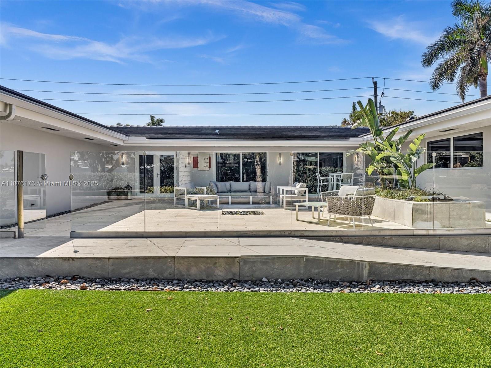 Experience luxury living in this Spacious and beautifully renovated 5 bed, 4.5 bath home in Hollywood Lakes. Offering over 4,800 sq. ft. with waterfront views and a short stroll to Southlake. Key features include a Sub-Zero refrigerator, 3 high-efficiency A/C units, a whole-house generator, newer roof, and impact windows/doors that fill the home with natural light. The spa-like wet room with MTI soaker tub adds a touch of luxury. Outdoors you'll enjoy a fenced backyard with an expansive screened patio/pool combination and large oversized patio in the front with a 2 car garage. Perfect as a primary residence or Airbnb. Walking distance to the beach, Hollywood Broadwalk, and only 10 minutes from Fort Lauderdale Airport—this home truly delivers the ultimate South Florida lifestyle.