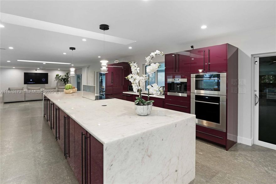 Experience luxury living in this Spacious and beautifully renovated 4 bed, 4.5 bath home in Hollywood Lakes. Offering over 4,800 sq. ft. with waterfront views and a short stroll to Southlake. Key features include a Sub-Zero refrigerator, 3 high-efficiency A/C units, a whole-house generator, newer roof, and impact windows/doors that fill the home with natural light. The spa-like wet room with MTI soaker tub adds a touch of luxury. Outdoors you'll enjoy a fenced backyard with an expansive screened patio/pool combination and large oversized patio in the front with a 2 car garage. Perfect as a primary residence or Airbnb. Walking distance to the beach, Hollywood Broadwalk, and only 10 minutes from Fort Lauderdale Airport—this home truly delivers the ultimate South Florida lifestyle.