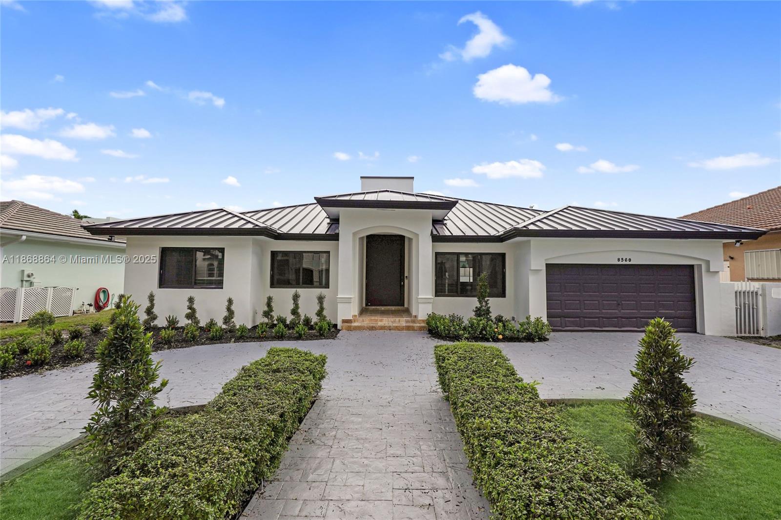 Welcome to this beautifully remodeled home located at 8560 NW 169th Terrace. This stunning property has been meticulously updated and is ready for its new owners. Step inside and discover a bright, open-concept layout featuring a brand new kitchen equipped with top-of-the-line stainless steel appliances, sleek cabinetry, and gorgeous countertops. The entire home boasts fresh paint, new flooring, and modern fixtures throughout, creating a clean and inviting atmosphere. Both bathrooms have been fully renovated with stylish vanities and updated tiling. The spacious backyard offers a perfect retreat for outdoor living and entertaining. With its prime location and turnkey condition, this home is a must-see.
