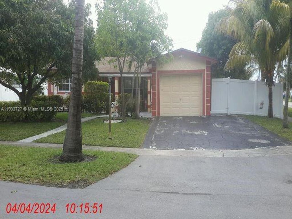 Photo of 3301 NW 32nd Ct, Lauderdale Lakes, FL 33309 (MLS # A11903727)