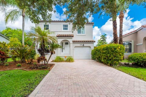 Photo of 690 NW 159th Ln, Pembroke Pines, FL 33028 (MLS # A12023312)