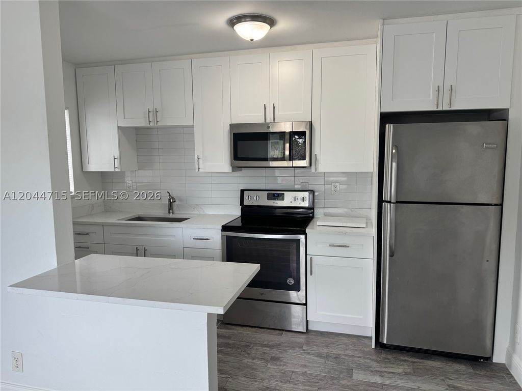 Photo of 495 NW 43rd Ct #1, Oakland Park, FL 33309 (MLS # A12044715)