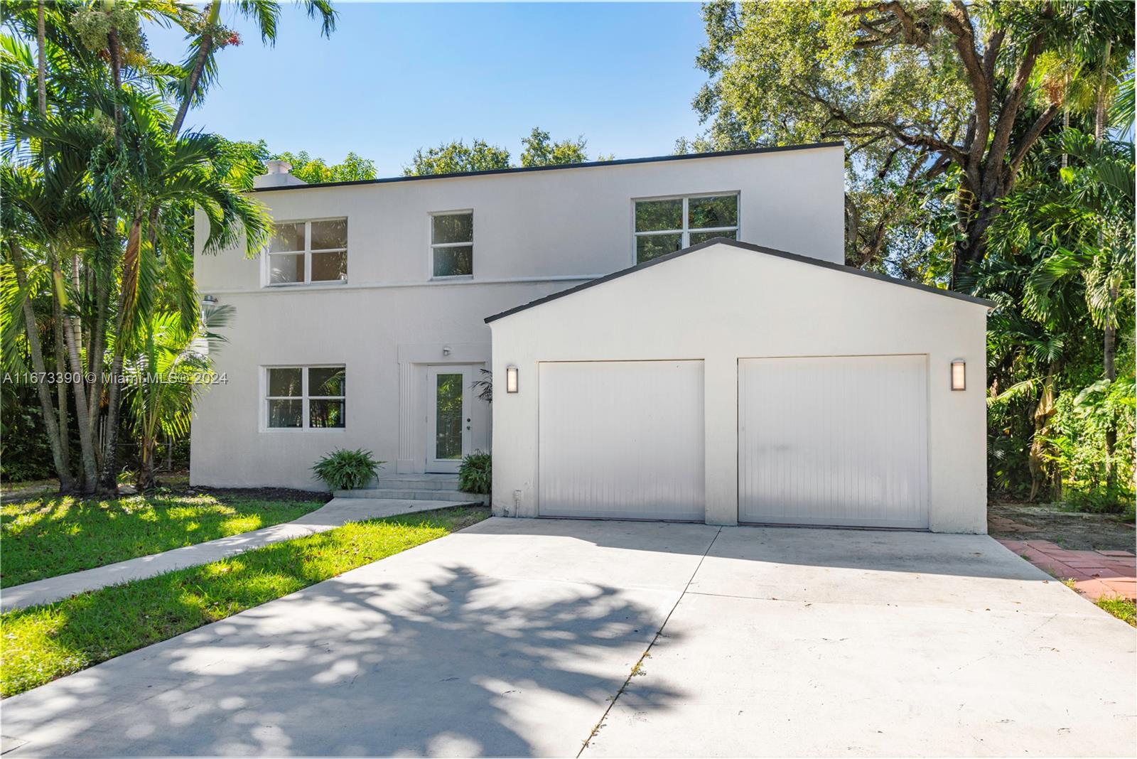 Beautiful Art Deco two-story home surrounded by a canopy of oak trees, located in the heart of Miami's historic Grove Park neighborhood—a true diamond in the rough. The large yard offers plenty of room for a pool and a guest house. The kitchen has been updated with a Viking stove, and the bathrooms have been renovated. Additionally, there is a brand-new roof and a two-car garage. This home is just 10 minutes away from South Beach, downtown Miami, Brickell, and Coconut Grove, and is only blocks away from Miami Marlins baseball stadium. A must-see that won’t last long! Easy to show—please call the listing agent for more details.