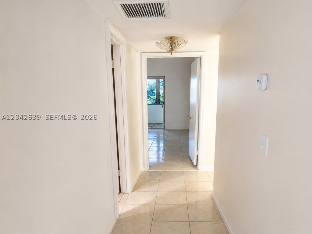 Photo of 500 W Village Green Cir W #308, Palm Springs, FL 33461 (MLS # A12042639)