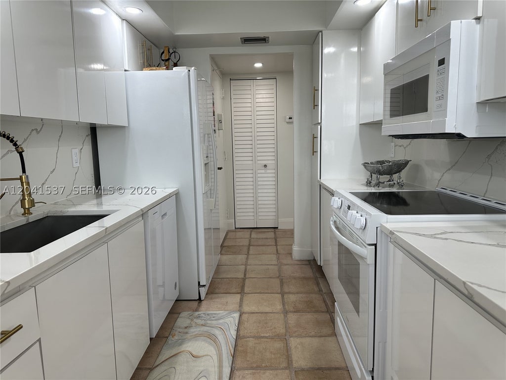 Photo of 1200 Saint Charles Pl #618, Pembroke Pines, FL 33026 (MLS # A12041537)