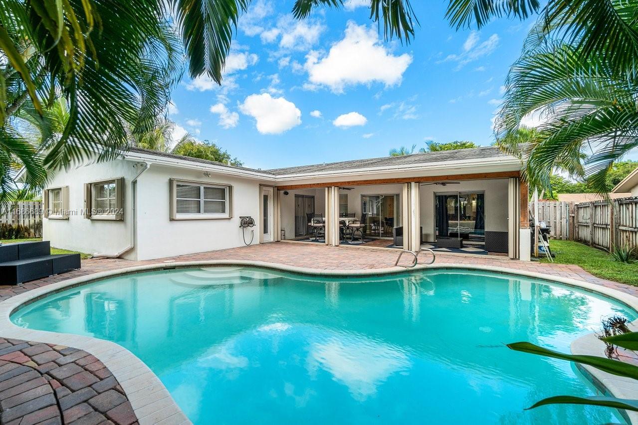 Welcome to your dream oasis in the heart of Fort Lauderdale! This beautifully maintained 3-bedroom, 2-bathroom ranch home offers the perfect blend of comfort, style, and outdoor living. Situated in a tranquil neighborhood, this residence features a spacious open floor plan that invites natural light and warmth throughout.
The master bedroom is a serene retreat, complete with an en-suite bathroom for added privacy. Two additional well-appointed bedrooms provide plenty of space for family, guests, or a home office. Both bathrooms are tastefully designed, ensuring comfort and convenience for everyone.Step outside to your private backyard paradise, where you’ll find a sparkling swimming pool surrounded by lush landscaping.