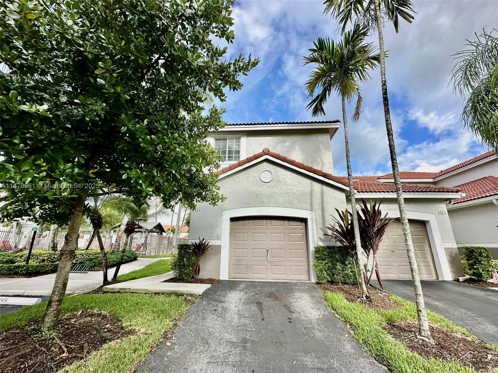 Beautiful and spacious 4BR/2.5BA corner townhouse for rent in the gated community of San Simeon in Weston. This bright, move-in-ready home features updated kitchen cabinets doors, newly installed flooring upstairs, and a fully remodeled upstairs bathroom. The main floor offers open living and dining areas, a guest half bath, and laundry with washer/dryer. Private screened-in patio. Includes 1-car garage plus 1 driveway space. Community amenities include pool, playground, and serene green spaces. Located near major highways, restaurants, parks, and shopping.