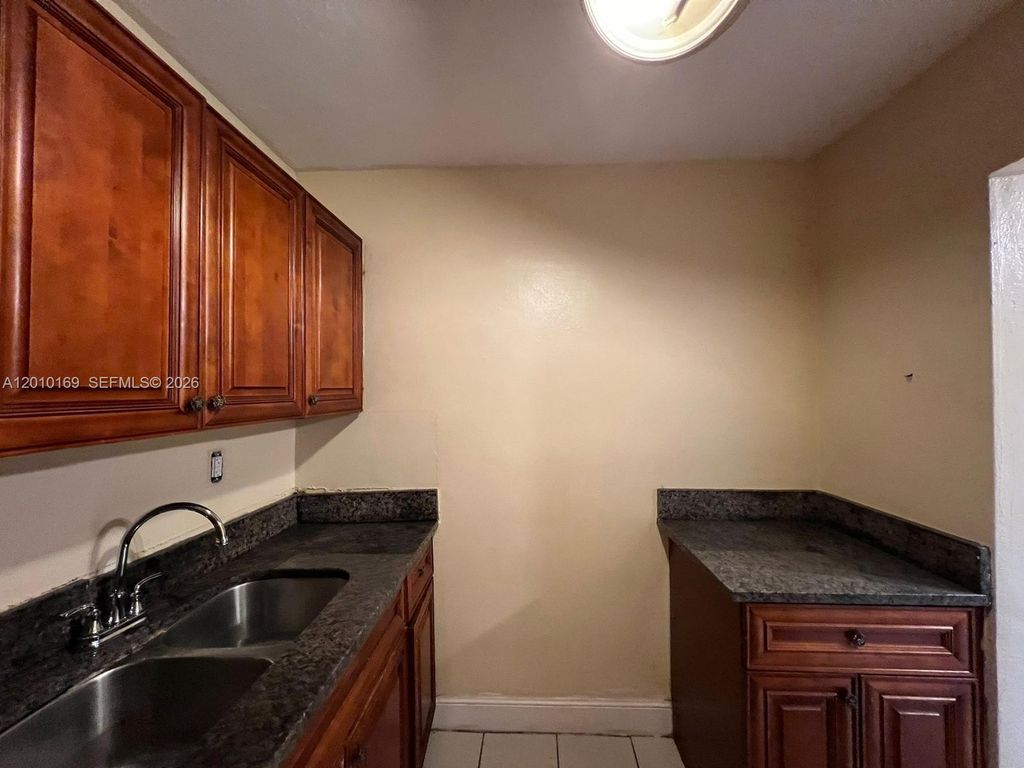 Photo of 5411 NW 22nd St #5411, Lauderhill, FL 33313 (MLS # A12010169)