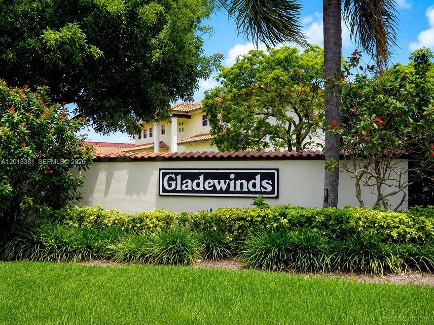 Welcome to Gladewind Heights, a gated community in the heart of Kendall! This spacious 2-story home features 3 bedrooms and 3 full bathrooms, including one bedroom and full bath on the first floor. Tax roll reflects a 4/3 with open den configuration. Bright living areas offer vaulted ceilings, ceramic and wood floors, formal living/dining spaces, and Florida room. Upgraded kitchen with granite countertops, stainless steel appliances, breakfast nook, and ample cabinetry. Spacious primary suite with walk-in closet, double sinks, soaking tub, and en-suite bath. Roof, electrical panel, and A/C condenser are 5 years old; fence is 3 years old. Features include paved patio/terrace, covered carport with storage, accordion shutters, laundry room, and extra-parking. Low HOA of $170/month with pool, clubhouse, gym, and playground. Centrally located near schools, shopping, dining, parks, and major expressways.