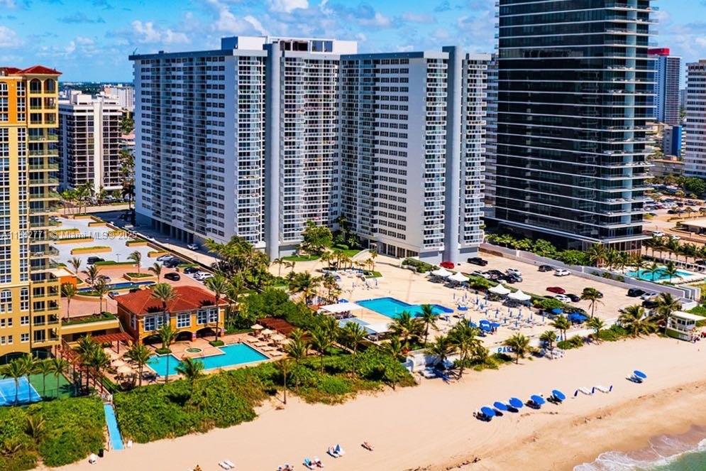 Welcome to this fabulous 3-bedroom, 2-bathroom residence, located directly on the sands of Hallandale Beach. Featuring a modern, open, and split layout that enhances both comfort and privacy, this bright and spacious unit offers a contemporary kitchen, brand-new impact windows, Travertine flooring and a large private balcony showcasing views of Ocean Dr and the Intracoastal Waterway. Designed by architect Morris Lapidus, the building offers the perfect balance of luxury, comfort, and beachfront lifestyle. including an oceanfront pool, fitness center, spa, 24/7 security, valet parking, and beach service. Rentals after one year of ownership. Don’t miss this exceptional opportunity to own a premier beachfront property—ideal as a full-time residence or a high-value investment.