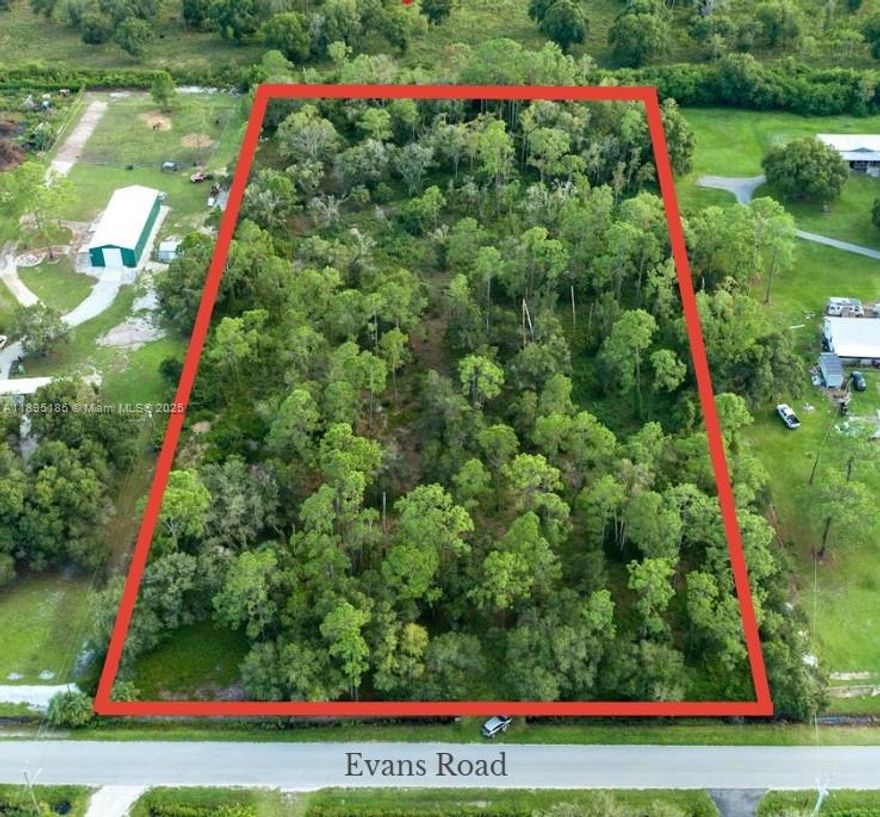 Beautiful 4.5 -Acre Tract Near LaBelle, FL. Stunning 4.5-Acre parcel on a paved road near the fast-growing rural town of LaBelle, just 30 minutes from Fort Myers. Land is partially cleared with many mature trees for beauty and privacy, partially fenced with double gates, and features a scenic stocked pond with a center island. Perfect for kids, animals, and country living. Property may be split through Hendry County for family compound or future resale. Area allows site-built, modular, or mobile homes, and outbuildings are easily permitted.