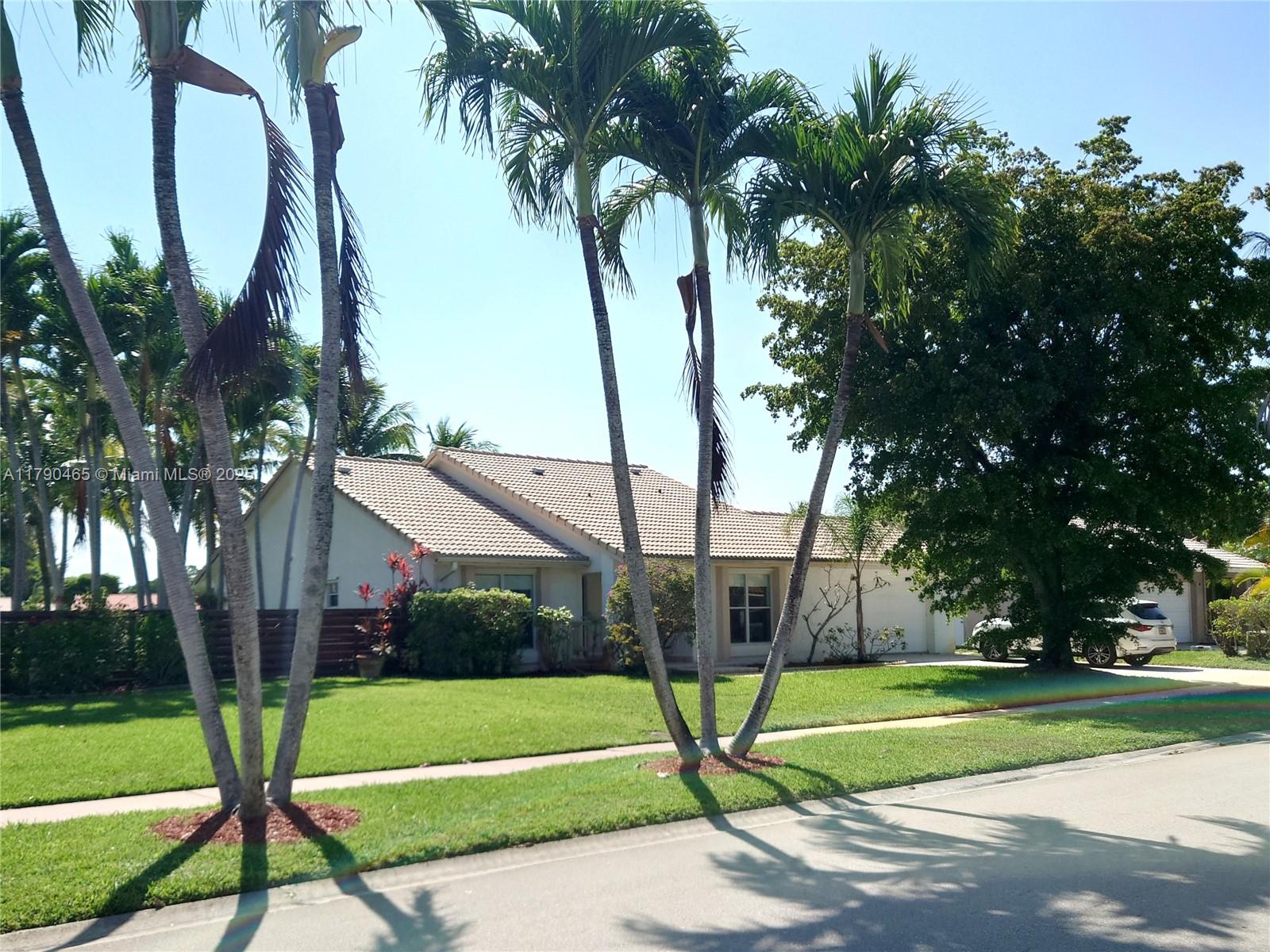 Spacious, beautiful upgraded 3 bedroom, 2 bathroom house with serene lake view and screened pool located at Timbers of Boca, off of Lyons road, between Glades Rd and Palmetto Park Rd. Nestled within A-rated schools, limitless shopping options and worship centers. Minutes from Uptown Boca, Boca Town Center Mall and FAU. This luxurious home features 2 car garage, total 2206 sqft, 1461 sqft under air. All stainless steel GE appliances and granite countertops. Wall to wall seamless wood looking tile across the house (except bathrooms). Wet bar with wine cooler fridge. Brand new custom window treatments. Large backyard with sun deck. Large swimming pool facing lake view, diamond brite interior and pool tiles were recently redone. Rent includes lawn and pool care.