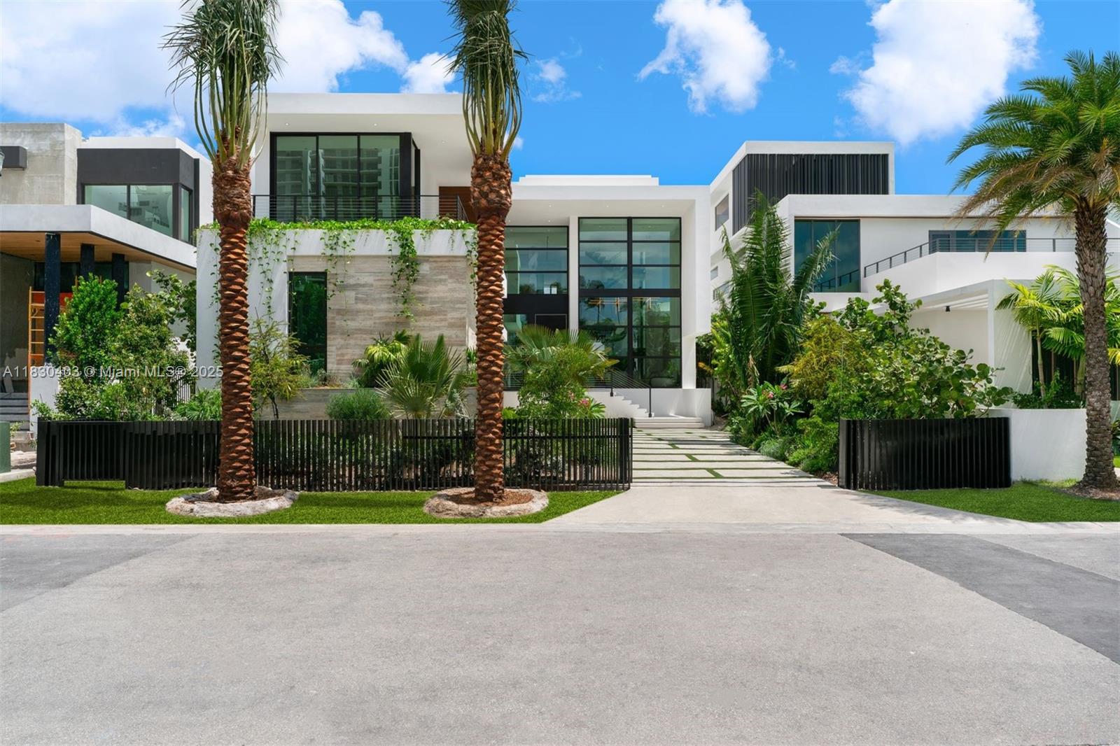 Experience luxury living in this extraordinary waterfront home in the Venetian Islands. This 6,370 sqft A/C, 9,785 sqft total space architectural gem features 6 bedrooms and 7.5 bathrooms, blending modern style with timeless elegance. Enjoy panoramic bay and skyline views that flood each room with natural light. A custom Italian kitchen offers premium Wolf & Sub-Zero appliances, wine cellar, and Porsche Technology lighting. Soaring double-height ceilings create spacious living areas perfect for entertaining. Outdoors features a summer kitchen, heated pool, and 60 ft of water frontage. Located on a quiet cul-de-sac. Built by Insignia Construction Company and developed by The Boschetti Group.