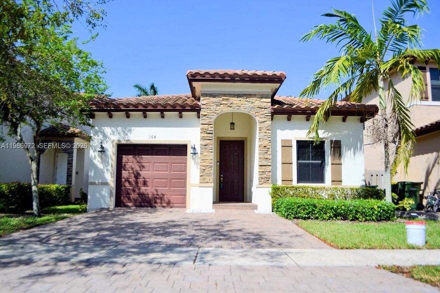 Barbados at Oasis is offering a 1 Story 4 Bedroom 2 Bath Home w/ Garage, and you won't want to miss it!!! As you enter the home's foyer, flow easily through the home's open, well distributed, and well lit floor plan featuring Volume Ceilings, Large neutral colored Ceramic Tiled Floors and Natural Light. This home also features a fully plumbed and electric Gourmet Kitchen w Island, Espresso Cabinetry, Stainless Steel Appliances, Pantry and an over-sized great room adjacent to enjoy. There is a flex area that can be used as a formal dining room, additional Family Room, or game area; as well. The Primary Bedroom is Large, with volume/recessed ceiling and Primary Bathroom with Dual Sinks, Semi-private commode, glass enclosed Walk-In Shower and large Walk-In Closet. All rooms still have the original carpeting; except the front room which now has vinyl floors. Single Car Garage and 2 additional parking spaces (on a Brick Paver driveway), and an EV Port installed by the owner for your convenience. Barbados also offers Upscale Amenities such as Community Club House, Pool and Fitness Center included in your low monthly maintenance fees of just $121 per month. Hurry... property won't last.