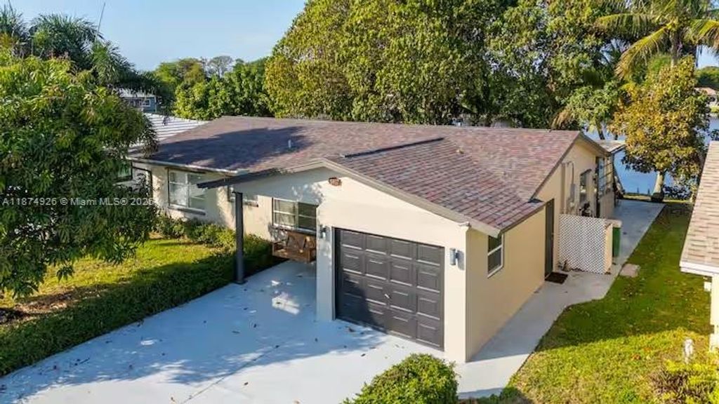 Photo of 5817 NW 70th Ave, Tamarac, FL 33321 (MLS # A11874926)