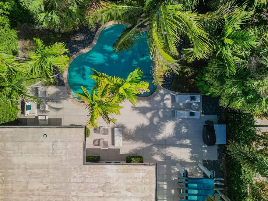 Mid-century modern gem located on tranquil and sought after North Bay Rd in Miami Beach. As you enter the private loggia you are immersed in a zen-like environment that carries throughout the house. Expansive entertainment areas, huge dining room with seating for 12 guests and a huge backyard with a lagoon style heated pool; the perfect retreat. Media/tv room is adjacent to the family room. Modern kitchen with oven, gas cooktop, steam oven, microwave, subzero + under counter fridge. Oversized master bedroom overlooking the pool; 2 large walk-in closets + 2 hall closets with a tub & separate shower in the master bath. Two additional bedrooms + a 4th/office/den with 3 bathrooms & two car garage complete the house. 4,000+sqft under AC, 11,460 sqft lot. New generator & water filtration system.