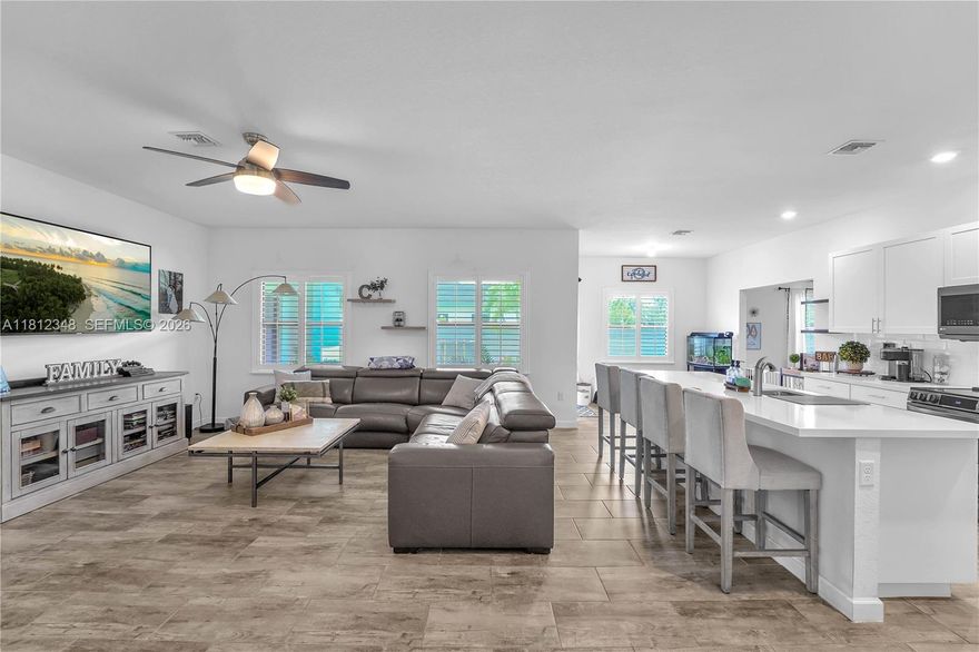 Stunning 4BD/3BA corner-lot home built in 2018 with only one side neighbor for added privacy! Features an open-concept layout filled with natural light, a modern kitchen with stainless steel appliances and spacious island, plus walk-in closets in every room. Includes a private guest suite with full bath—ideal for extended family or rental income potential. 2-car garage, beautifully landscaped, and move-in ready. Prime location near US-1, Turnpike, and Berry Farms!