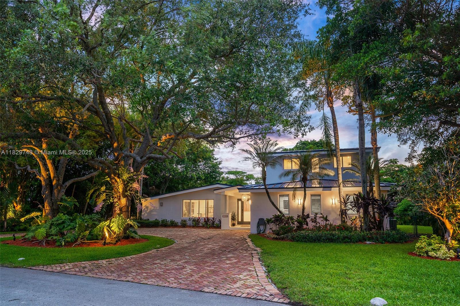 Welcome to this turnkey charming Pinecrest home located on a quiet coveted street. This tropical oasis is set on one of the largest lots in the neighborhood (21,469 sf), boasting a lush backyard complete with an entertainment patio, grill, pool, and mature fruit trees throughout.The home features a fully remodeled main living area with new flooring, a brand-new kitchen, custom dining woodwork, and a bespoke library. Enjoy peace of mind with a 2023 metal roof and full impact windows and doors. Upstairs, the oversized primary suite includes a large walk-in closet and an additional room ideal for a gym or office. Located near Miami's top public and private schools. Easy to Show. Contact listing agent for a private preview. This home will not last!