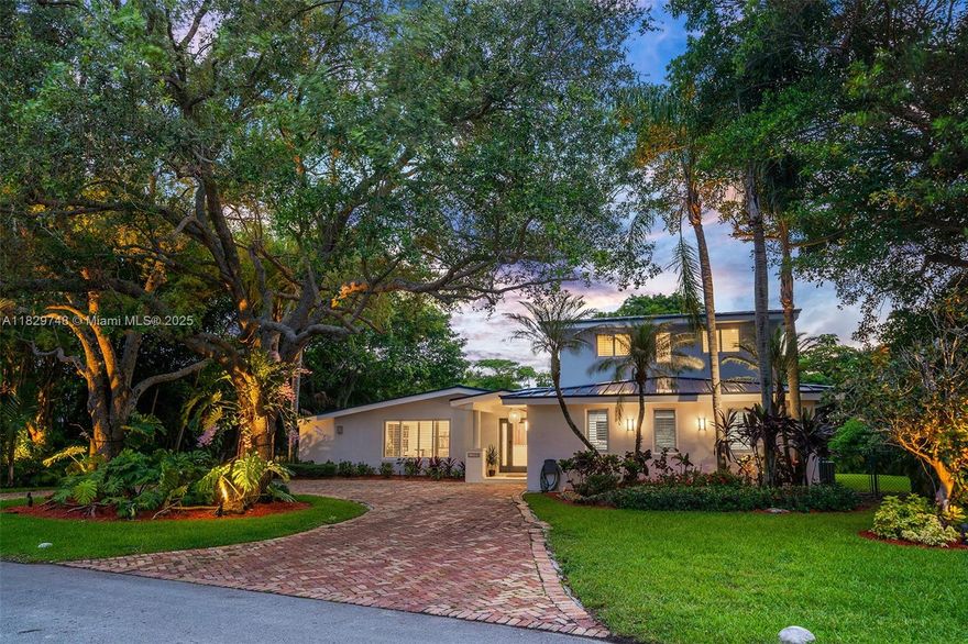 Welcome to this turnkey charming Pinecrest home located on a quiet coveted street. This tropical oasis is set on one of the largest lots in the neighborhood (21,469 sf), boasting a lush backyard complete with an entertainment patio, grill, pool, and mature fruit trees throughout.The home features a fully remodeled main living area with new flooring, a brand-new kitchen, custom dining woodwork, and a bespoke library. Enjoy peace of mind with a 2023 metal roof and full impact windows and doors.  Upstairs, the oversized primary suite includes a large walk-in closet and an additional room ideal for a gym or office. Located near Miami's top public and private schools. Easy to Show. Contact listing agent for a private preview. This home will not last!