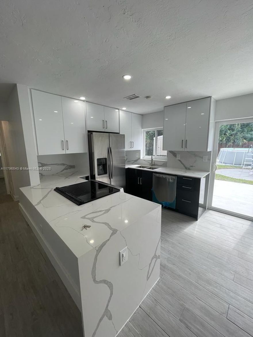 Renovated 2 beds 1 bath beautiful home. Open layout with renovated kitchen and S/S appliances. Quartz countertop. Snack/bar counter. Renovated modern bathroom. All impact windows throughout. Central A/C.Laundry room/storage with Samsung washer a dryer. Large permitted shed for extra storage. Enjoy an oversized private back yard surrounded by greenery and palm trees. You’ll enjoy a Beautiful new huge park 3 houses down the street with kids playgrounds, picnic areas, bike path, workout area, public restrooms