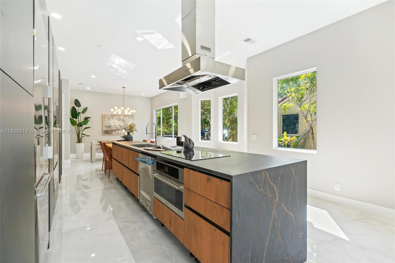 Fully renovated with high-end finishes, this 6 BD, 4 BA + den home offers one of the largest floor plans in the highly sought-after community of The Lakes in Weston. Set on a spacious 9,727 SF lot, this home features Italian porcelain tile throughout, a brand-new pool, and the kitchen showcases sleek Italian cabinetry and premium appliances by Miele, JennAir, and Fulgor Milano. The primary suite is conveniently located on the first floor with a spa-like bath featuring a smart toilet and Italian vanity cabinetry. Recent upgrades include a 2025 electrical panel, 2025 water heater, new impact windows (2025), and a 2019 roof. With a modern layout and luxurious design, this home is a rare turnkey opportunity in a gated community close to A+ schools, parks, dining, and highways.