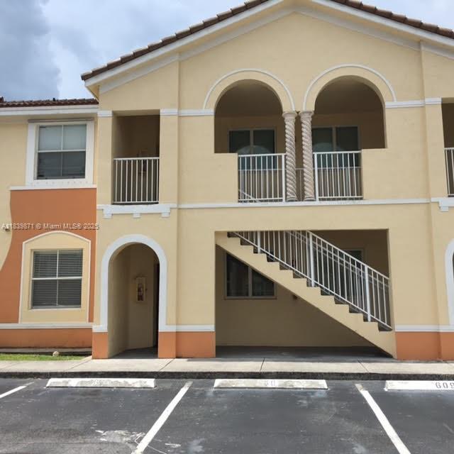 First floor unit, all tile floors, open yard in rear, washer and dryer inside, assigned parking plus guest parking. Many amenities, including pool, BBQ and rest area. Gated community with security patrol and management on site.