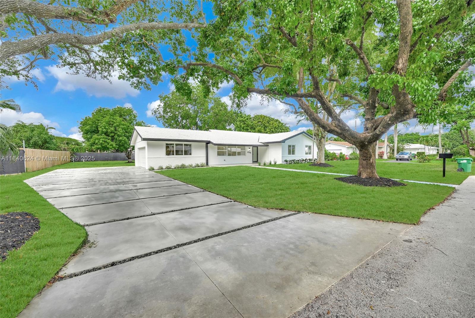 Step into this stunningly remodeled 3-bedroom, 2-bath home, located on a peaceful street in the heart of Palmetto Bay. Designed for both elegance and ease, this home features high ceilings, an open and airy family room, and a new beautifully designed kitchen with French doors that open to your private outdoor oasis.Every detail has been thoughtfully updated. The oversized backyard is perfect for family fun and entertaining, with mature mango and lychee trees providing shade, charm, and seasonal treats. The partially covered terrace offers a serene spot to relax year-round. Ideally situated near top-rated schools, parks, and family-friendly amenities, this home offers the perfect blend of luxury and livability.