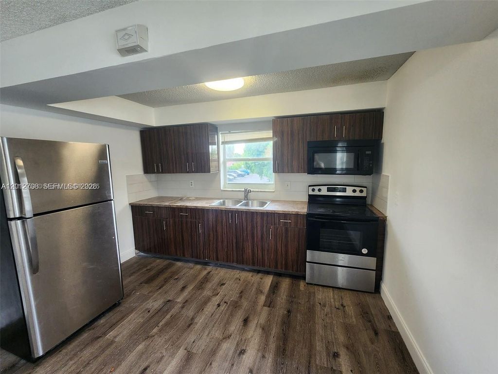 Photo of 4117 Woodside Dr #4, Coral Springs, FL 33065 (MLS # A12012708)