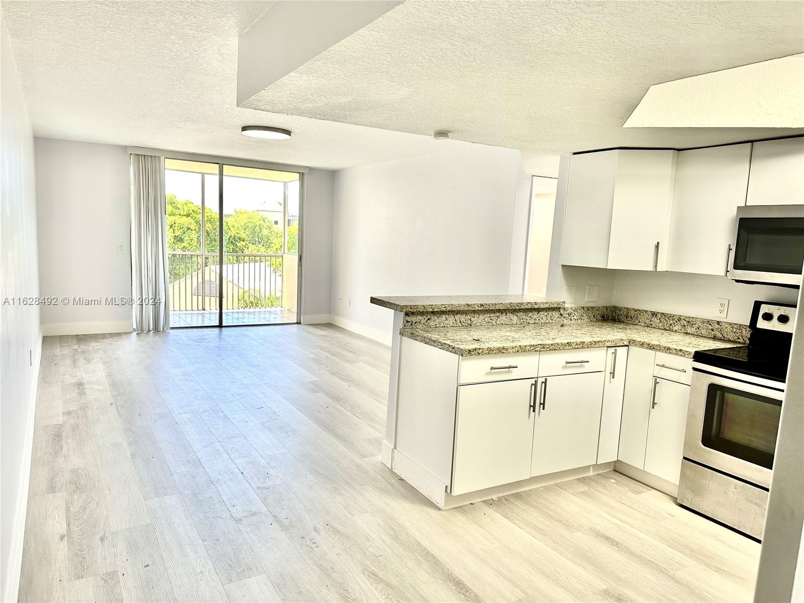 Bright and spacious 2 Bed/2 Bath apartment in the heart of Doral! This unit features a large living/dining area, walk-in closets, and a big balcony with storage. Enjoy a modern kitchen with stainless steel appliances, quartz countertops, and upgraded floors. Full-size washer and dryer in the unit. Las Vistas is a gated community with 24-hour security, offering four swimming pools, tennis and racquetball courts, a gym, clubhouse, and barbecue area. Located steps from Downtown Doral dining and entertainment, with access to Doral's A+ schools. Minutes from major highways, Miami International Airport, and FIU. Ready to move in!