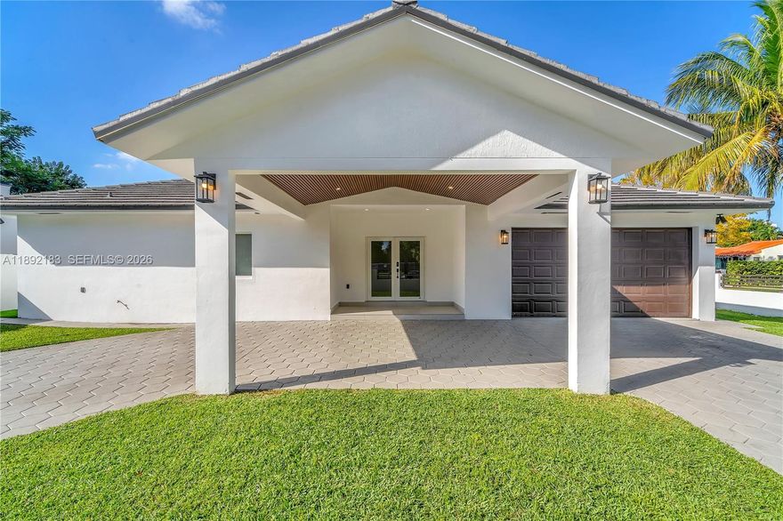 Perfectly positioned on a large corner lot in the heart of Shenandoah, this stunning high-ceilings residence blends timeless charm w/ modern sophistication. Originally built in 1990, it has been completely renovated from top to bottom, featuring a brand-new roof, high-impact windows and doors, and premium designer finishes throughout. Spanning 2,673 square feet, the thoughtfully designed split floor plan includes 4 spacious bedrooms and 3.5 bathrooms. Two-car garage, and a private driveway. Flooded with natural light and surrounded by lush landscaping, the home exudes warmth and style. Located across from Bryan Park, this property offers exceptional curb appeal and comfort just minutes from Coral Gables, Coconut Grove & Brickell. Video tour available!