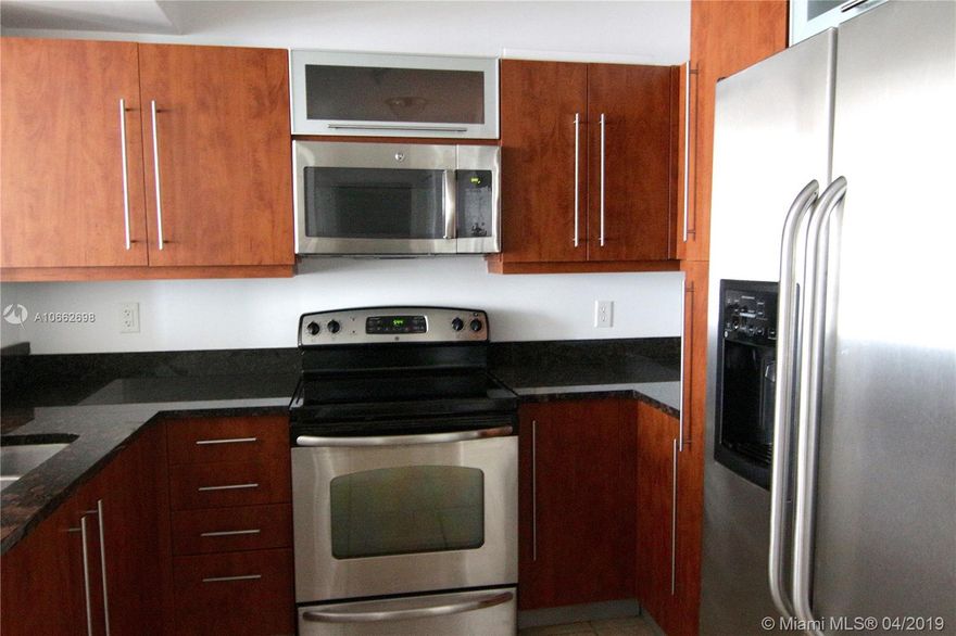 **Lowest priced in the building!** Ready to move- in 1 bedroom, 1 bathroom unit in the luxurious Toscano Condominium, freshly painted! Unit features a spacious walk- in closet with upgraded Elfa shelving system, SS appliances, granite countertops, washer and dryer inside and beautiful laminate wood flooring throughout. Maintenance includes water, high-speed INTERNET, CABLE TV, trash, sewer, pest control.  Enjoy complimentary valet for all your guests, high-end fitness center with sauna, pool with spa, BBQ areas, party room, business center, on-site ATM and 24 hour concierge and security. Pet friendly! Excellent location right across from Dadeland Mall with easy access to the Palmetto highway, metro-rail, great restaurants and shops and walking distance to Publix.