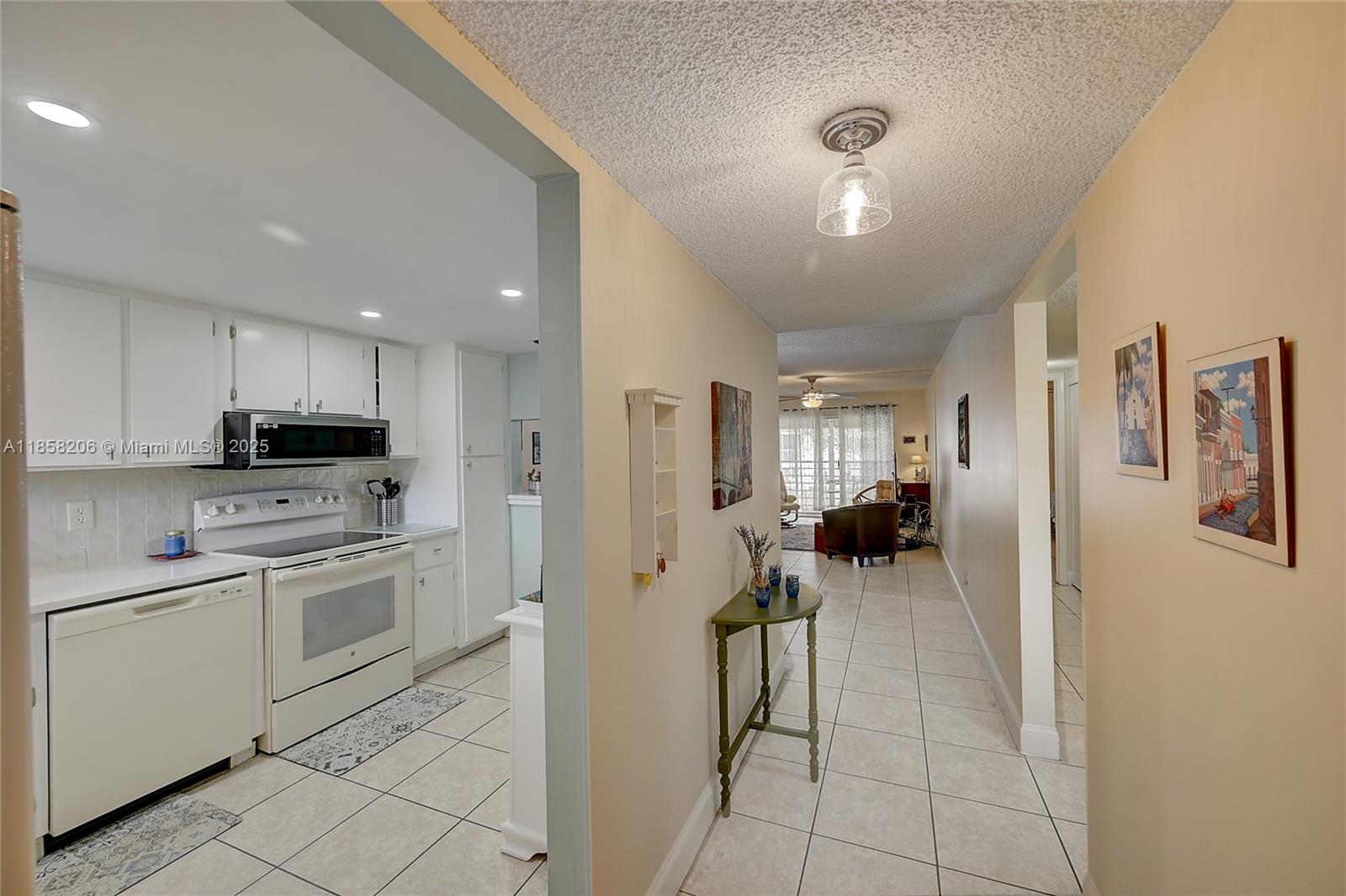 Welcome to this beautiful condo. This spacious 2-bedroom, 2-bath condo offers a bright open layout with serene views to the pool right from your private screened balcony. Enjoy a recently updated kitchen with plenty of storage, a split bedroom floor plan for privacy, and a large primary suite with a walk-in closet. Located in the desirable Poinciana community, Ashton Building. you’ll have access to a clubhouse, pool, fitness center, tennis, and an on-site restaurant—resort-style living at an affordable price! Conveniently situated near shopping, dining, entertainment, and just minutes from Florida’s beautiful beaches. Basic cable and water are included. This is the perfect opportunity to own a slice of paradise in Palm Beach County! "Furniture is negotiable"
