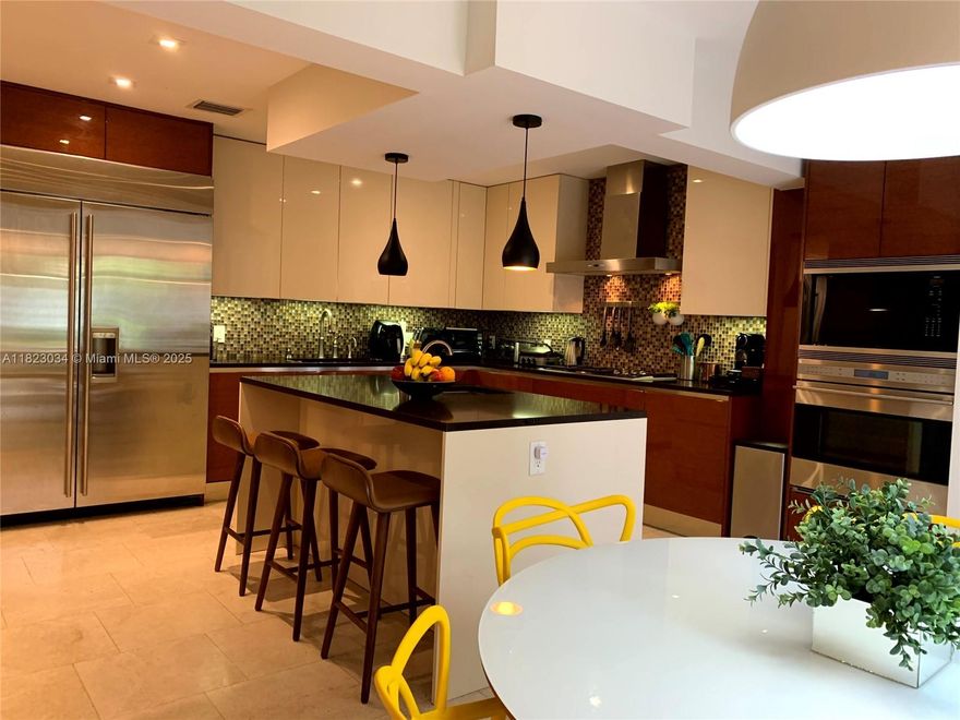 Unique Opportunity! Fully updated 4-bedroom, 3.5-bath modern home in the heart of Hollywood Lakes—just 5 minutes from the iconic Hollywood beach and Broadwalk—This spacious and bright home offers around 3,500 sqft of elegant living with marble floors, a sleek Italian kitchen with Miele, Subzero, and Wolf appliances, spa-like master bath, formal dining and living room,  inside laundry, custom his-and-hers closets, high-impact windows, built-in whole-house sound system, and a split floor plan perfect for family life or high-return Airbnb income, all set on the only street in the neighborhood to receive a multimillion-dollar anti-flooding renovation in 2025—on a prestigious Diplomat Parkway corner lot surrounded by $8M+ homes, with the sweetest mangos in town right in your backyard.