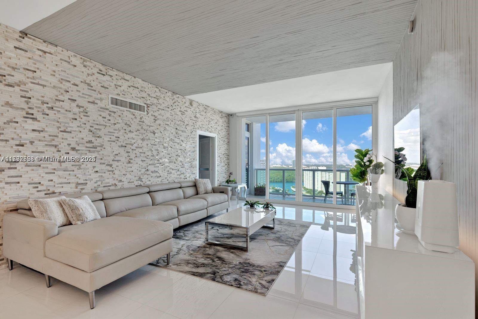 Spectacular Sunny Isles Beach Penthouse with Unmatched Views in Prime Location Welcome to your dream home in the sky! Experience luxury living in this beautifully completely remodeled 2-bedroom, 2-bath penthouse featuring spectacular, unobstructed views of the Miami skyline. With soaring 10-foot ceilings and a bright, spacious layout, this unit offers a large balcony perfect for enjoying sunsets. A fantastic investment opportunity, given its prime location and desirable amenities, including a heated pool, two gyms, tennis courts, jacuzzi, library, and BBQ area. Located just steps from the beach, it's close to shops, restaurants, and parks, with easy access to Aventura Mall and South Beach. Embrace the Miami lifestyle in this exceptional residence. Schedule your private showing today!