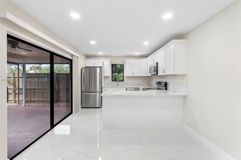 Photo of 7744 W Courtyard Run W, Boca Raton, FL 33433 (MLS # A12014157)