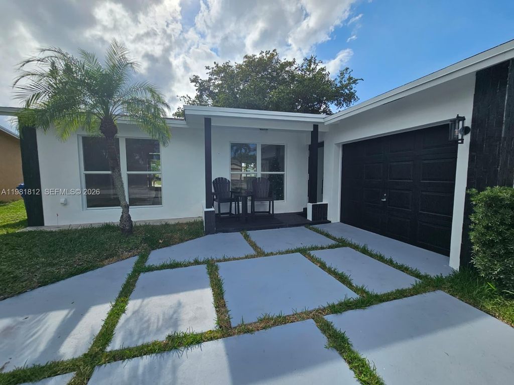 Photo of 11450 NW 32nd Pl, Sunrise, FL 33323 (MLS # A11981812)