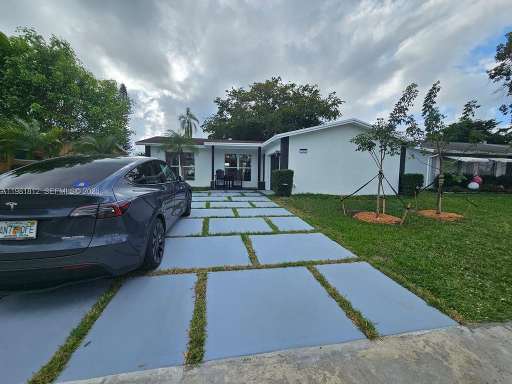 Photo of 11450 NW 32nd Pl, Sunrise, FL 33323 (MLS # A11981812)