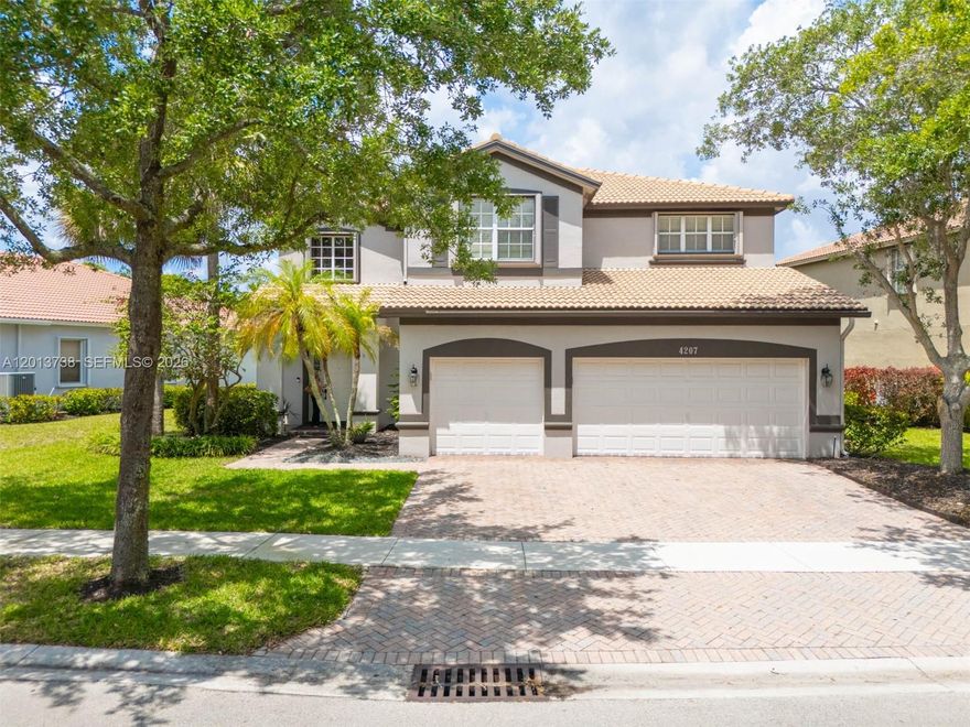 Welcome to this beautifully maintained 5-bedroom, 4-bath residence located in the prestigious community of Isles of Weston, where comfort, style, and convenience come together. This spacious home features a remodeled kitchen (2023) with elegant granite countertops, stainless steel appliances, and under-cabinet lighting—perfect for both everyday living and entertaining. The oversized primary suite offers generous space and walk-in closets, a spacious walk-in shower, soak-in tub and dual vanities, while a convenient first-floor bedroom is ideal for guests. Recent upgrades include two new A/C units, a new electrical panel with surge protection, and waterproof laminate flooring on the stairs and second floor, offering both durability and modern appeal. Enjoy indoor-outdoor living with a new screened lanai and a thoughtfully designed yard featuring a French drain system. The home is fully equipped with accordion shutters throughout for added peace of mind.  Residents of Isles of Weston enjoy resort-style amenities, including a clubhouse, pool, playground, fitness center, and volleyball and basketball courts. Ideally located within walking distance to top-rated Manatee Bay Elementary, and just minutes from Falcon Cove Middle and Cypress Bay High School, this home offers an exceptional lifestyle in one of Weston’s most sought-after communities. Don’t miss this opportunity to own a move-in ready home in a premier location!