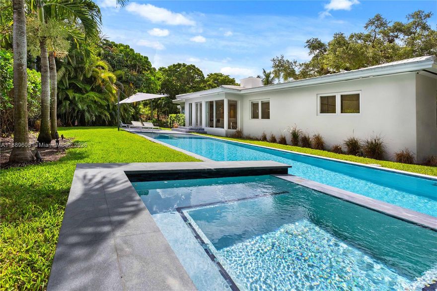 Beautifully updated & thoughtfully redesigned, this 3-bedroom, 2-bath home sits on a 14,000 sq ft corner lot in one of Coral Gables’ most desirable neighborhoods. Blending classic charm with modern sophistication, the home features refinished hardwood floors, a chef’s kitchen, designer European fixtures, and a bright, open-concept layout. Designed by a leading smart home, AV, and lighting specialist, it offers seamless integration of comfort, convenience, and security. Step outside to enjoy a stunning pool and hot tub, outdoor shower, and a lush, private yard ideal for entertaining. With impact windows and doors, European-style bathrooms, high-end finishes, and a two-car garage, this move-in-ready residence is the perfect blend of style and substance, smart, stylish, and built to impress.