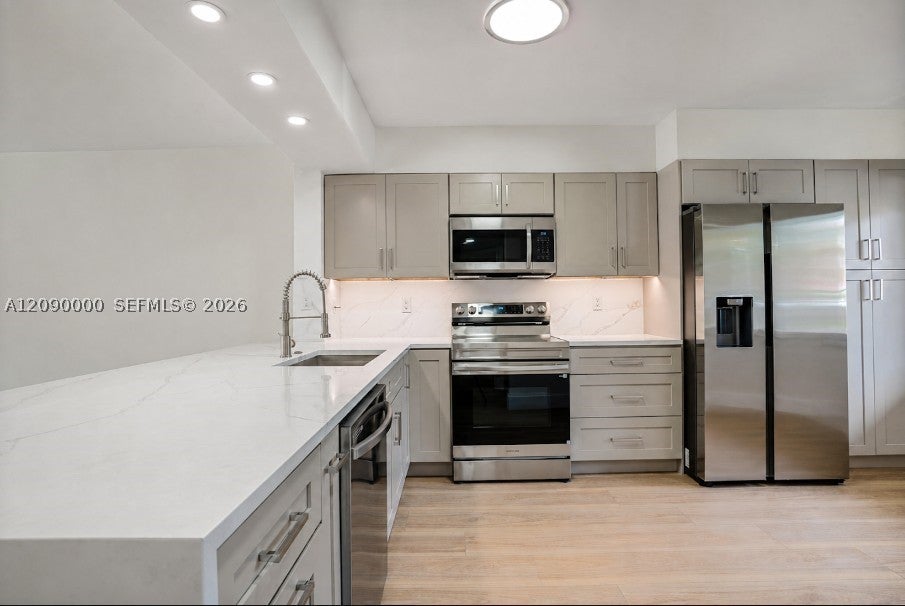 Photo of 5810 Crystal Shores Dr #102, Boynton Beach, FL 33437 (MLS # A12090000)