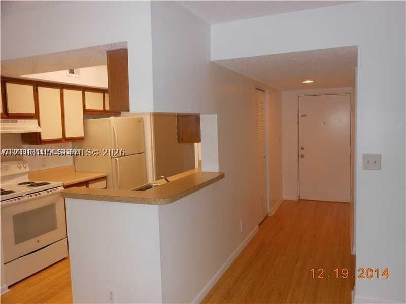 Photo of 5686 Rock Island Rd #119, Tamarac, FL 33319 (MLS # A12106105)