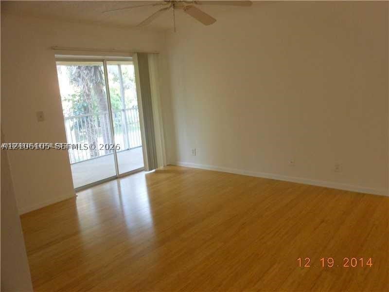 Photo of 5686 Rock Island Rd #119, Tamarac, FL 33319 (MLS # A12106105)